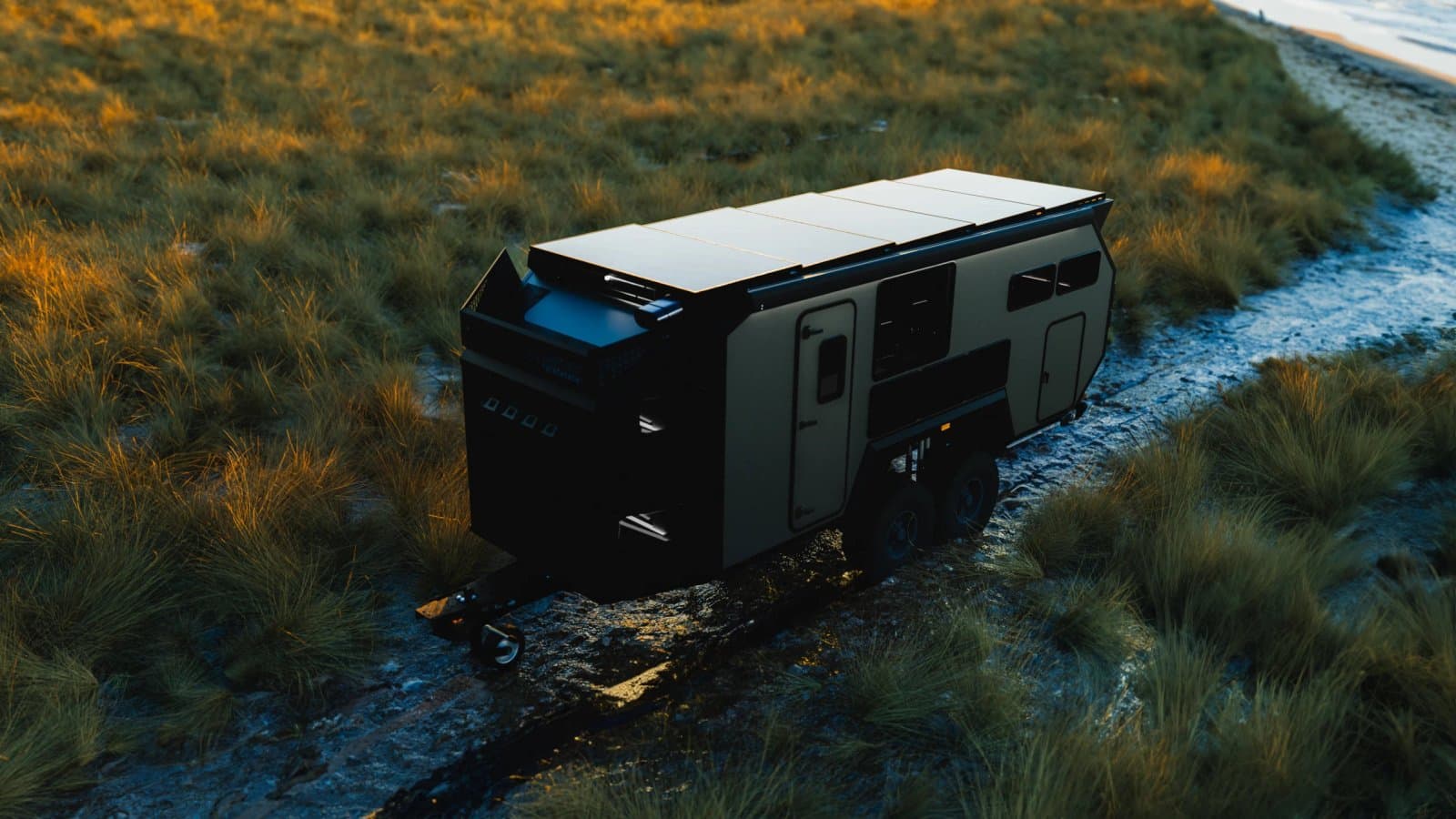 Bruder EXp-10 off-road expedition caravan parked on a beach
